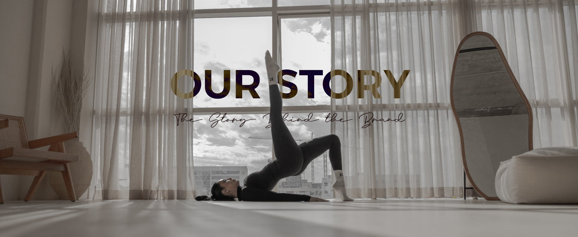 Person doing a handstand in a room with large windows and 'Our Story' text overlay.